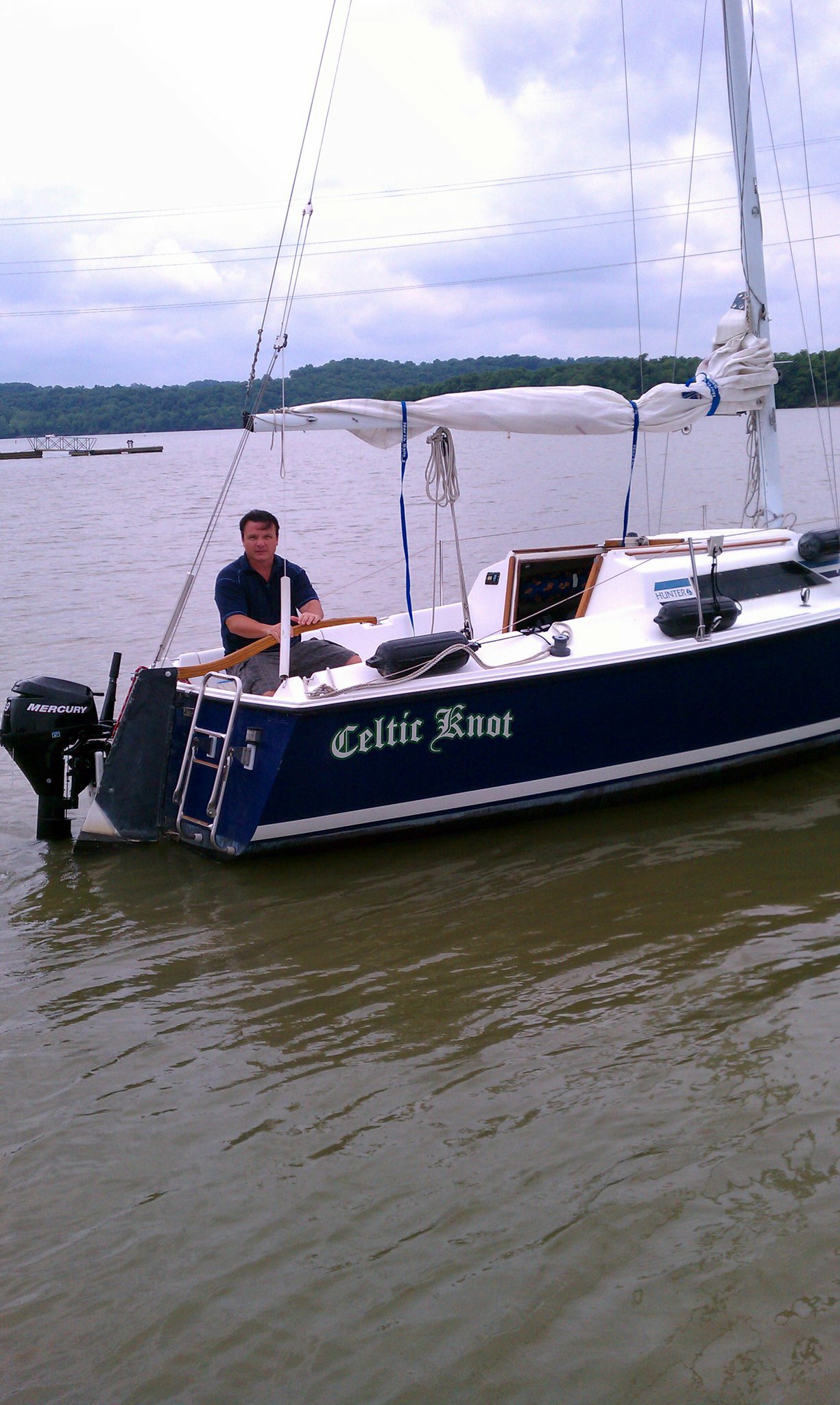 Our first sailboat....a Hunter 23...I'm not sure why I look so angry in this picture...maybe it was my "pirate face"